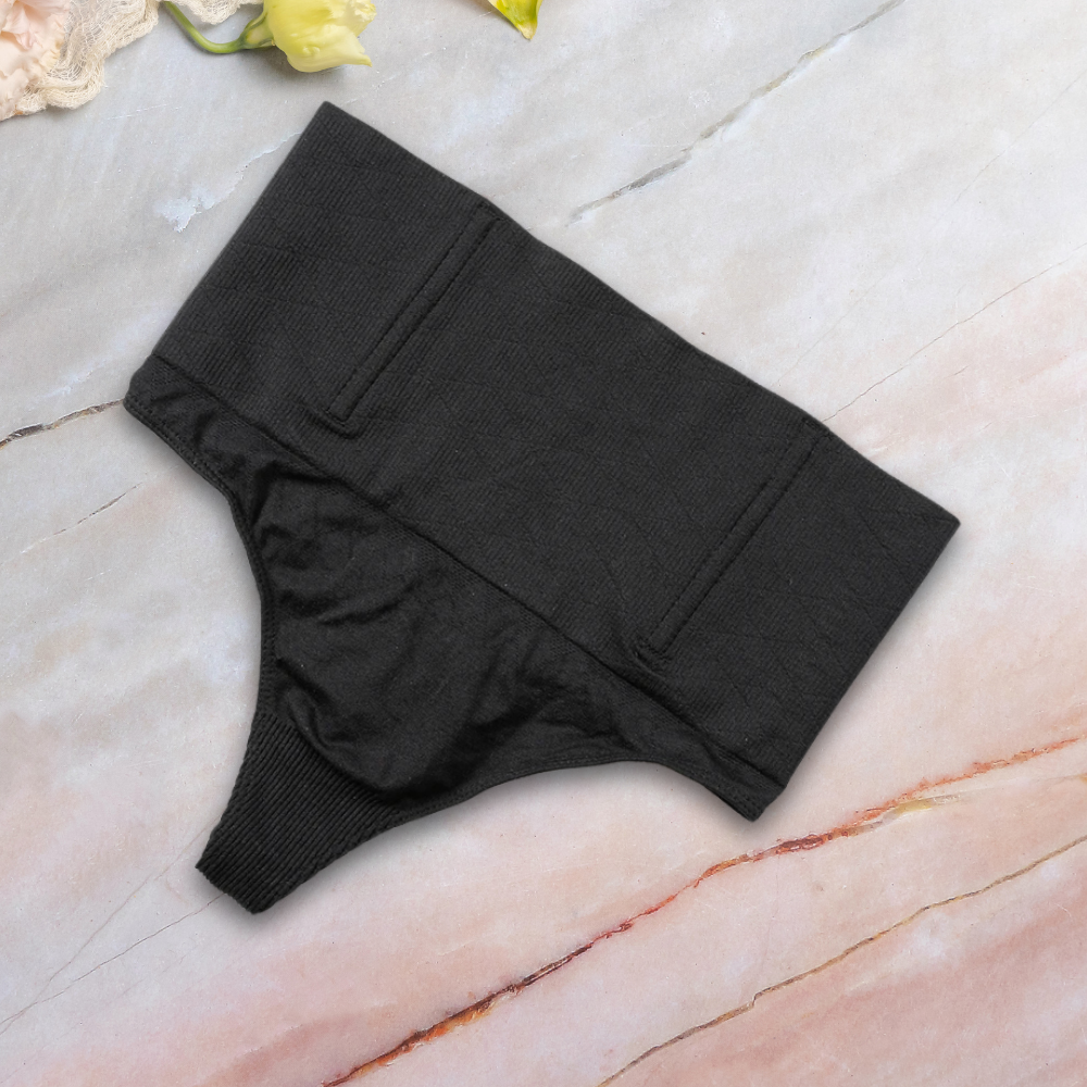 black thong shapewear on the marble surface